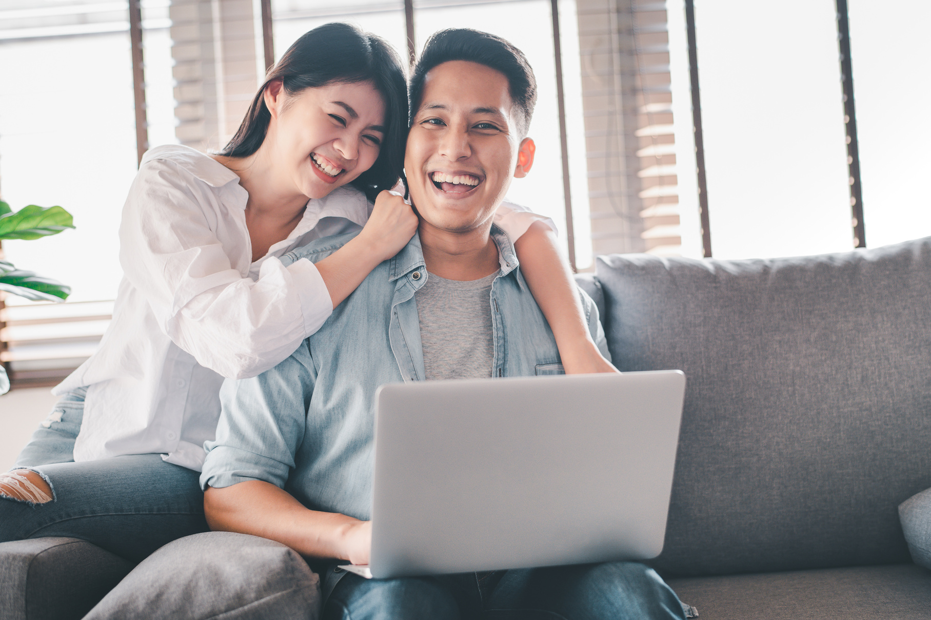 Couple with Laptop at Home
